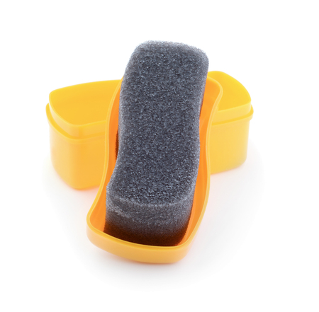 Yellow sponge for shoes isolated on whiteの写真素材