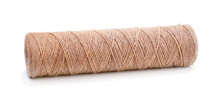 Spool of brown natural rough twine isolated on white background