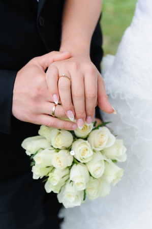Wedding hands, Bouquet of rosesの写真素材