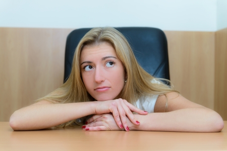 Portrait of a young woman thinking about something whith laptopの写真素材