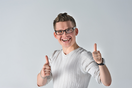 Portrait of young man showing LIKE gestureの写真素材
