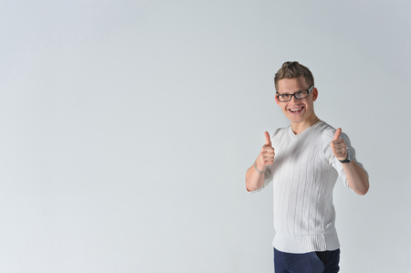 Happy boyfriend show sight thumbs up and good luckの写真素材
