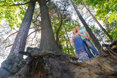 Beautiful young happy couple in the forestの写真素材