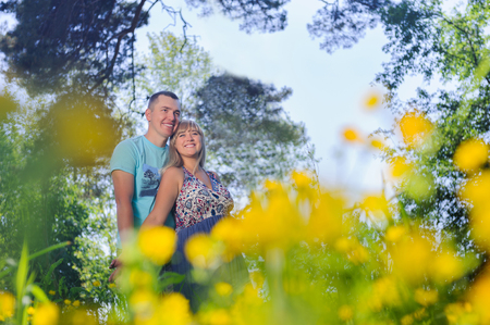 Young happy couple having fun in the parkの写真素材