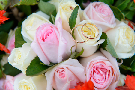 Wedding rings on wedding bouquetの写真素材