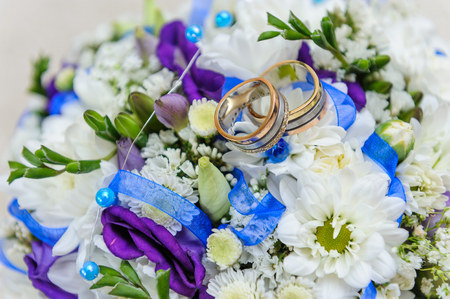 Wedding rings on wedding bouquetの写真素材