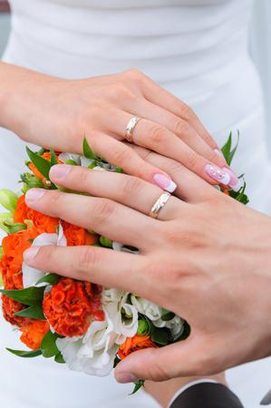 Couples hand with wedding ringsの写真素材