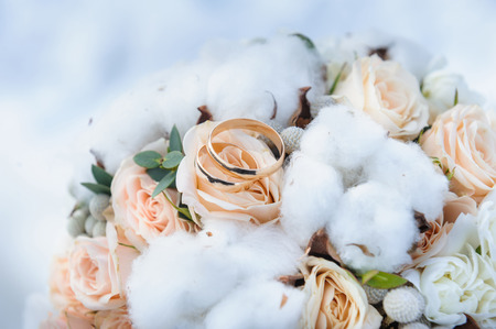 Wedding rings on the brides bouquetの写真素材