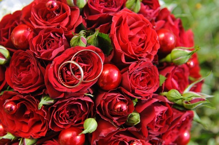 Wedding rings on wedding bouquetの写真素材