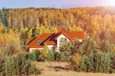 Beautiful view of peaceful house in the autumn sunlight at dusk