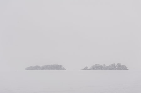Silhouette of the island in cloudy foggy weather.の写真素材
