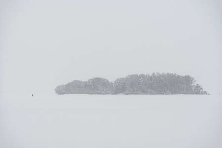 Silhouette of the island in cloudy foggy weather.の写真素材