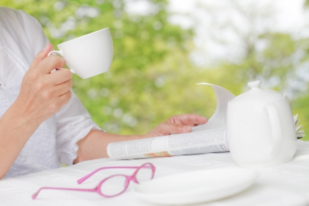 Reading in the open cafeの写真素材