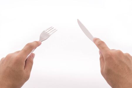 How to hold a fork knifeの写真素材
