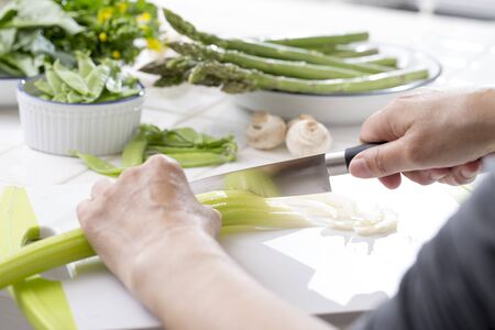 Hand of women cooking in the kitchenの写真素材