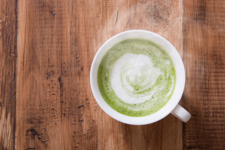 Warm Matcha Latte on the table