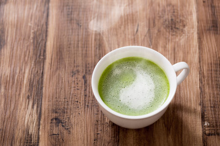 Warm Matcha Latte on the table