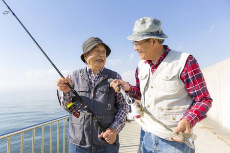 Middle-aged Japanese Group Enjoying Fishingの写真素材