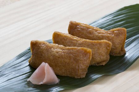 Japanese food, Inari Sushi, served in a Japanese style and taken by handの写真素材