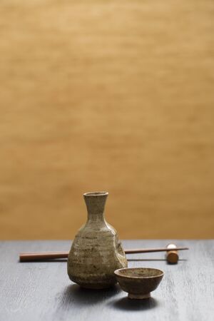 Japanese sake ware, sake bottle and sake cup, background materialの写真素材