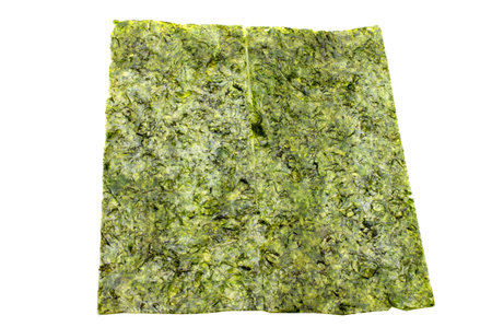 Pieces of seasoned dried seaweed isolated on whiteの写真素材