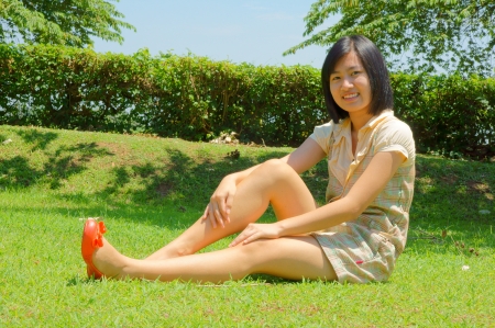 A pretty young woman sittingの写真素材