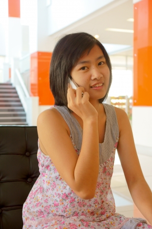 A pretty young woman on the cell phoneの写真素材