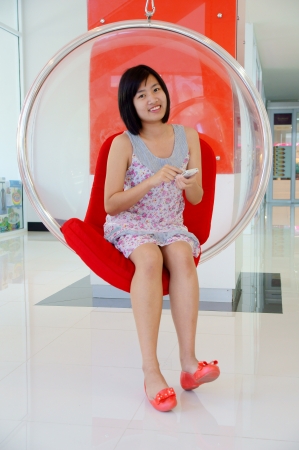 A pretty young woman on the cell phoneの写真素材