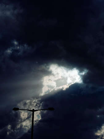 I parked my car in the parking lot of the airport and watched the outdoor lights and the sun shine through the clouds.の写真素材