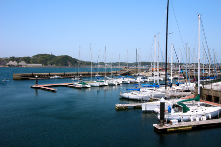 Scenery of the marina facing the calm sea of the summerの写真素材