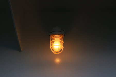 Illumination of the deck of an orange-shining ship