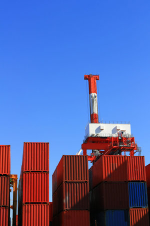 Containers and cranes stacked in harbors