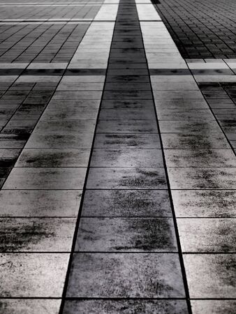 Abstract monochrome photo of paved sidewalkの写真素材
