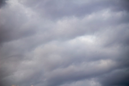 A photo of gray clouds covering the sky as a background material