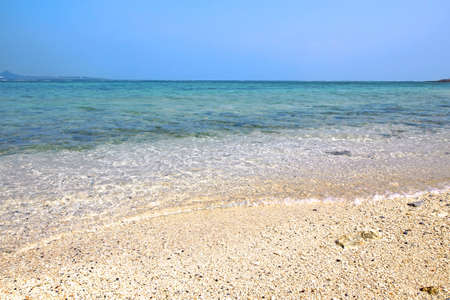 Beautiful Okinawan beach with clear water wavesの写真素材