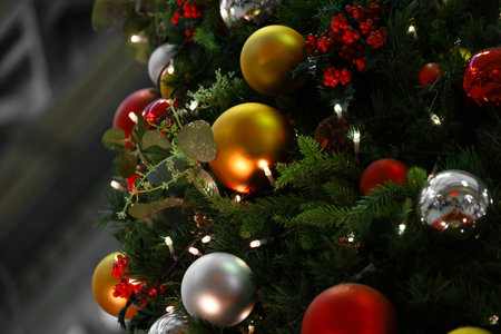 Close up photo of a decorated Christmas tree in the cityの写真素材