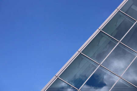 Clear blue sky and glass buildingsの写真素材