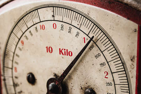 Close-up shot of retro and vintage scale or balance indicating weight in kilo.の写真素材
