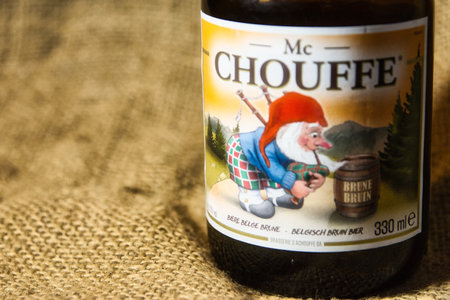 Antwerp, Belgium, December 2020: Illustrative Editorial: Mc Chouffe Belgian speciality beer from brewery D'Achouffe. Selective focus. Textured backgroundのeditorial素材