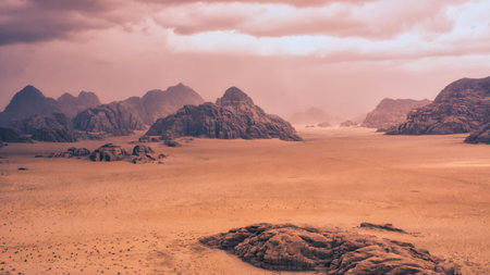 Storm and rain clouds over the desert landscape of Wadi Rum in Jordan. Panoramic shot 16:9 aspect...