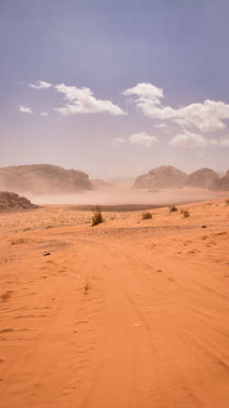 Vertical desert off road track leading into the mountains of Waid Rum. 9:16 aspect ratio.の写真素材