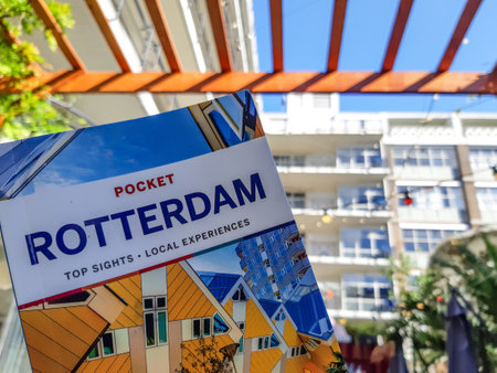 Lonely Planet travel guide book of Rotterdam with architecture in the background. Travel and Tourism in the Netherlands. Illustrative Editorial.のeditorial素材
