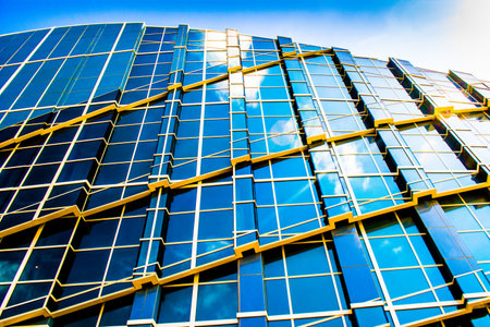 Glass business office building facade, reflection of the sky, exterior of skyscraper.のeditorial素材
