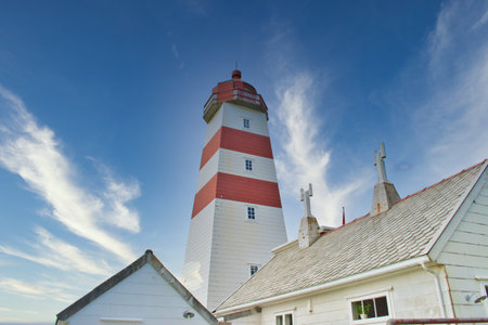 Alnes, Norway, May 2015: View on the wooden lighthouse and building of Alnes in Godoya, Norwayのeditorial素材