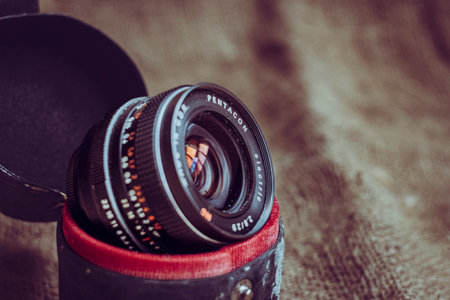 Antwerp, Belgium, June 2022, Illustrative Editorial: Shot of vintage Pentacon Electric camera lens, made in the DDR. Many enthusiasts mount vintage lenses on their digital camera.のeditorial素材