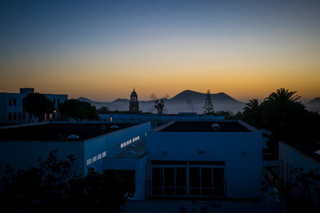 Silhouette sunset view on the village of Teguise on the Canary Island of Lanzarote, mountains in the background.の写真素材
