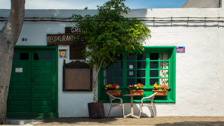 Yaiza, Lanzarote, Spain, March 2023: View on a cozy outside restaurant with street table in Yaiza, Lanzaroteのeditorial素材
