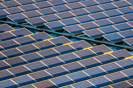Closeup view on flat roof solar panels installed in the direction of the sun