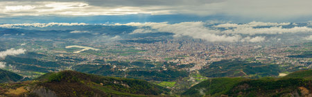 High angle view over Tirana and surrounding urban area in Albaniaの写真素材