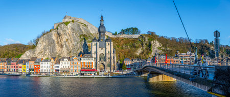 Dinant, Belgium, December 24th 2025: Dinant cityscape with view on Notre-Dame Church, Citadel, and Charles de Gaulle bridge crosing the river Meuse in Wallonia, Belgiumのeditorial素材